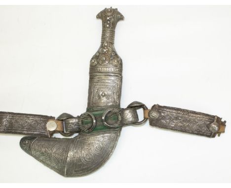 Omani Saidi Khanjar dagger/ornamental scabbard with sharply curved blade, white metal ornate wirework decorated hilt, in simi