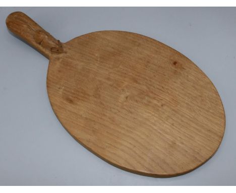 Robert Mouseman Thompson of Kilburn - an adzed oak oval cheese board, curved handle carved with signature mouse, W40cm D20.5c