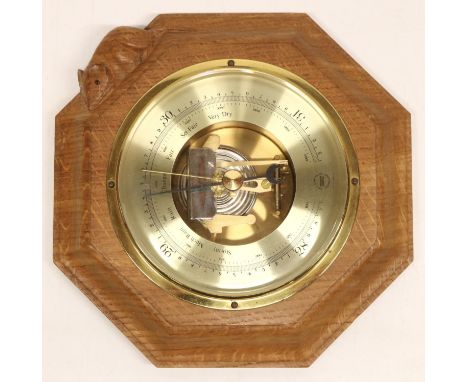 Robert Mouseman Thompson of Kilburn - an aneroid barometer, brass register in stepped octagonal case, carved with signature m