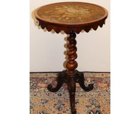 Victorian rosewood tripod table, circular tilt top with shaper frieze and inset with a coloured woolwork panel of foliage, on