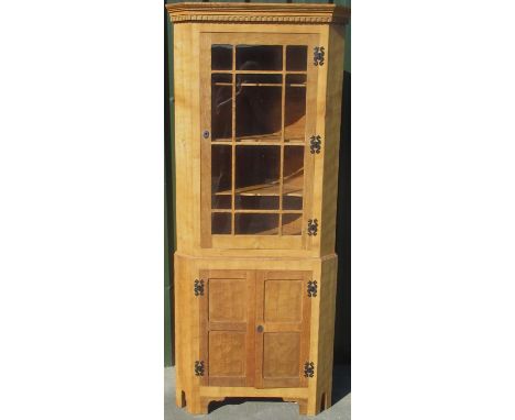 Alan Acornman Grainger, Acorn Industries Brandsby - an adzed oak standing corner cabinet, with dentil moulded cornice and ast