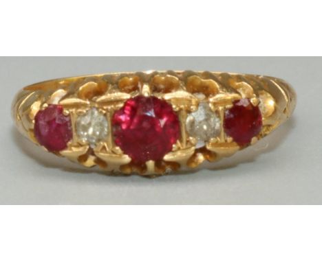 18ct yellow gold five stone ruby and diamond ring, the three round cut rubies separated by two brilliant cut diamonds, in cla