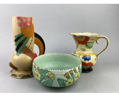 CHARLOTTE RHEAD FOR CROWN DUCAL CIRCULAR BOWL, the exterior decorated with pansies, 19cm diameter, along with two art pottery