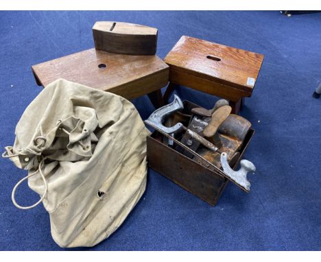 LOT OF VINTAGE TOOLS, including wood planes, hammers and a trowel, contained in a chest, along with two stools