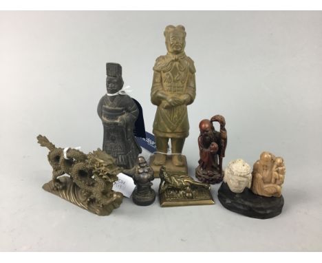 CHINESE BRASS FIGURE OF A DRAGON, 14cm long, along with a group of ceramic and other immortals and other ceramic figures (8)
