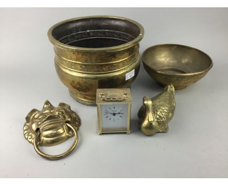 LOT OF BRASSWARE, including a jardiniere, bowl, door knocker, figure of a duck and a reproduction carriage clock (5)