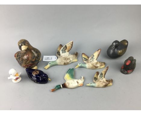 GRADUATED SET OF THREE FLYING DUCKS, along with another similar figure and other ceramic figures of ducks
