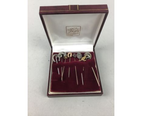 COLLECTION OF EIGHT VINTAGE STICK PINS, including two of horse shoe motif design, yellow metal kangaroo pin, purple gem set p