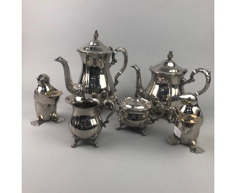 SILVER PLATED FOUR PIECE TEA SERVICE, along with two candle holders modelled as penguins (6)