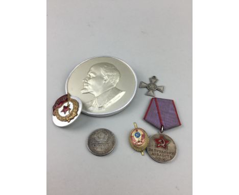 GROUP OF RUSSIAN MEDALS AND BADGES, including an embossed portrait plaque of Lenin, 10cm diameter