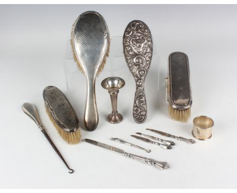 A group of silver items, including a three-piece dressing table set, comprising hairbrush, clothes brush and buttonhook, Birm