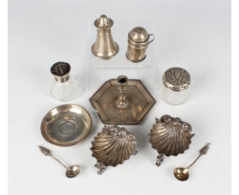 A pair of Victorian silver scallop shell salts, each raised on three dolphin feet, London 1874 by Alexander Macrae, length 6.