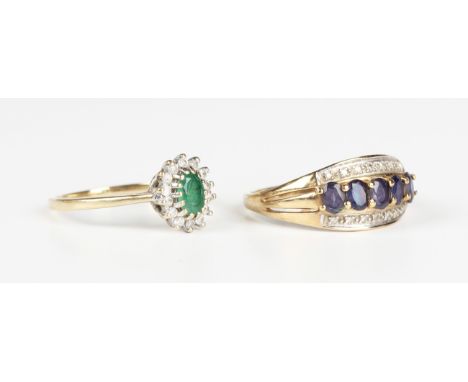 A 9ct gold, emerald and diamond oval cluster ring, claw set with the oval cut emerald within a surround of circular cut diamo