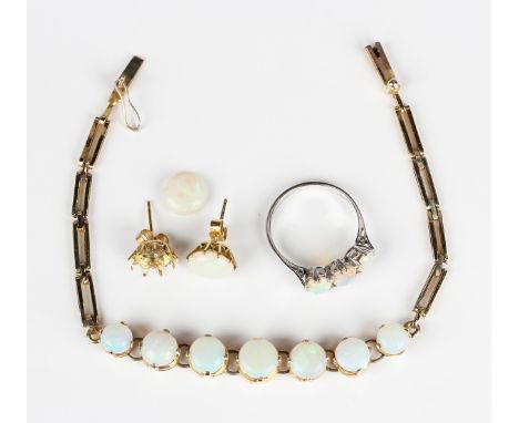 A group of opal set jewellery, comprising a gilt metal bracelet, claw set with a row of seven graduated circular opals, lengt