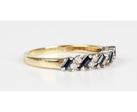 An 18ct gold, sapphire and diamond half eternity ring, mounted with a row of five baguette cut sapphires alternating with fou