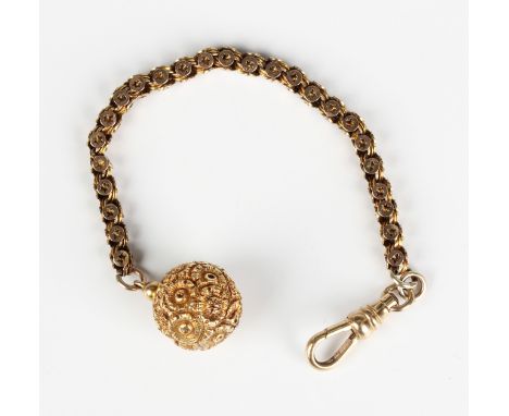 A gold dress chain, unmarked, fitted with a gold swivel, detailed '9ct', and a gold spherical pendant, decorated with flowerh