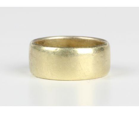 An 18ct gold wide band wedding ring, London 1972, weight 8.9g, ring size approx L1/2.Buyer’s Premium 29.4% (including VAT @ 2