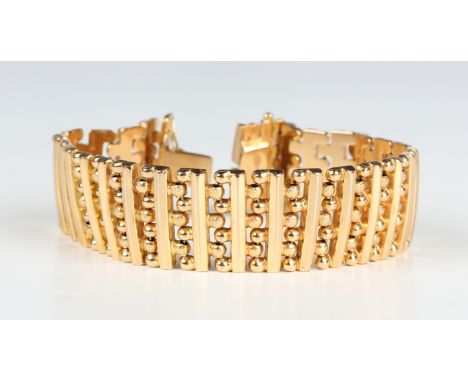 A gold wide bracelet in a bar and beaded link design, on a snap clasp, detailed '252 VI 750', weight 33.1g, length 20.5cm.Buy