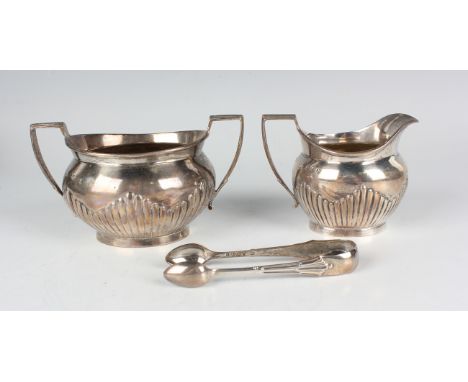 A late Victorian silver half-reeded two-handled sugar bowl and matching milk jug, London 1890 by Chawner &amp; Co, a pair of 