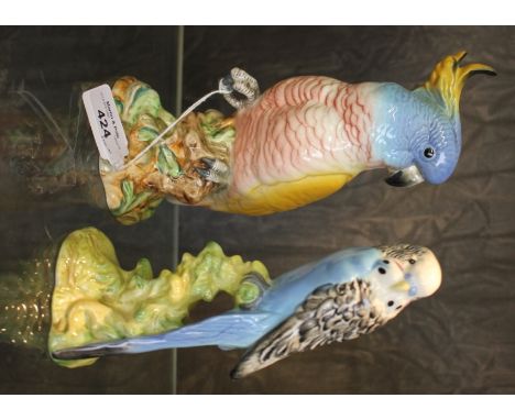 A Beswick figure of a cockatoo, no 1180, 21cm high and another of a budgie no 1216, 18cm high 