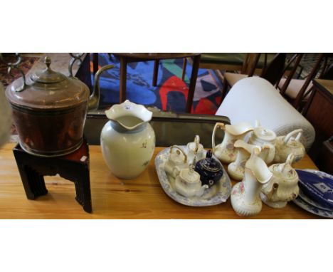 A set of three graduated Crown Devon jugs, various teapots, blue and white plates, lacquer corner tables and a copper kettle