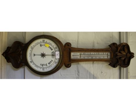 An Edwardian oak banjo barometer, carved with foliate scrolls, mercury thermometer, 85cm high
