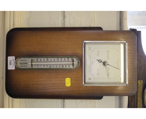 A 1950's oak Federal barometer, in a rectangular case with mercury thermometer, 39cm high