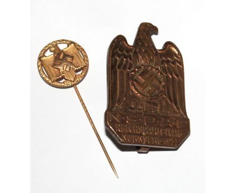 A 1942 gilt NSRL achievement stick pin together with a German Rally NSDAP Parteitag 1933 badge