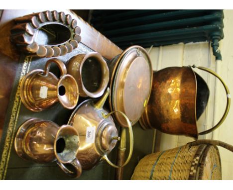 A Victorian jelly mould, a copper warming pan, a copper kettle, two measuring jugs and a copper vase.