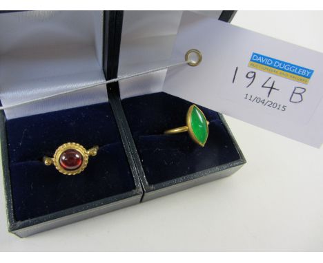 Gold plated Jade ring stamped 925 and a gold plated garnet ring stamped 925