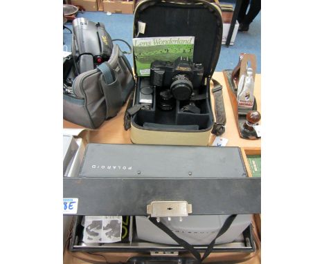 Canon T50 camera outfit cased and Polaroid 320 camera cased 