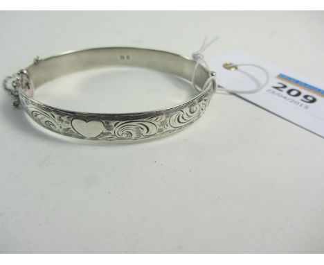 Hallmarked silver hinged solid bangle, bright cut decoration London 1961