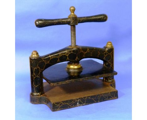 A vintage cast iron and brass Book Press, decorated in black and gold marble effect enamel, 17in (43cm) wide.