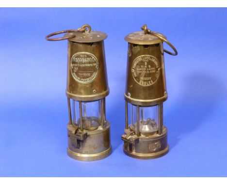 A Miner's Safety Lamp, type 6, brass and glass, by Eccles, 9in (23cm) high, together with another similar (2) 