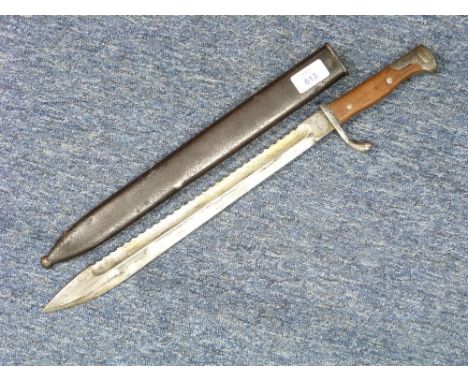 A W.W.1 German saw-back Butcher Bayonet, marked Deutsche Maschinenfabrik A-G Duisburg, with 14½in (37cm) blade, the steel sca