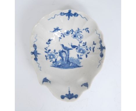 A Worcester Two Peony Rock Bird pattern shell shaped pickle dish, painted in blue with a bird perched on a tall pierced rock 