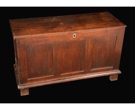 A William III oak blanket chest, hinged top enclosing a till, three panel front, stile feet, 73cm high, 124cm wide, c.1700
