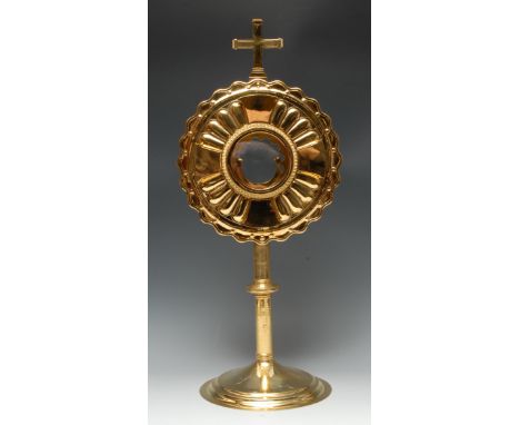 A George VI silver-gilt solar monstrance or ostensorium, the sunburst centred by the glazed luna, hinged door to verso enclos