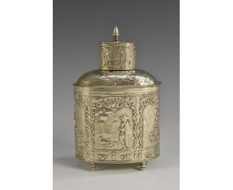 A 19th century Dutch silver oval tea caddy, embossed overall with scenes of pastoral idyll, push-fitting cover, turned feet, 