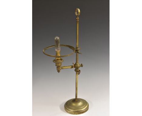 An early 20th century adjustable student's lamp, circular base, posted loop base, 51cm high, c. 1910