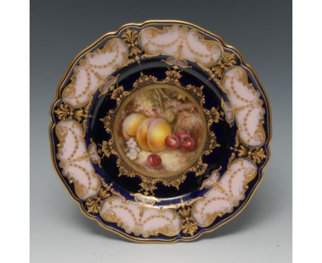 A Royal Worcester shaped circular plate, painted by Richard Seabright, signed, with ripe peaches and cherries, within a jewel