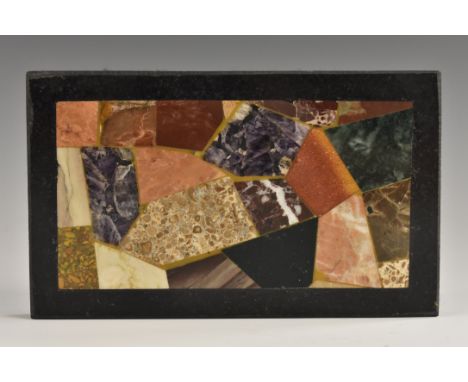 A pietra dura rectangular desk weight, inlaid with amethyst, fossil marble, agate and further decorative hardstones and marbl