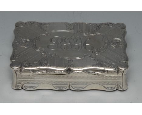 A large early Victorian silver shaped rectangular snuff box, engine turned and engraved with leafy scrolls, flowers and fruit