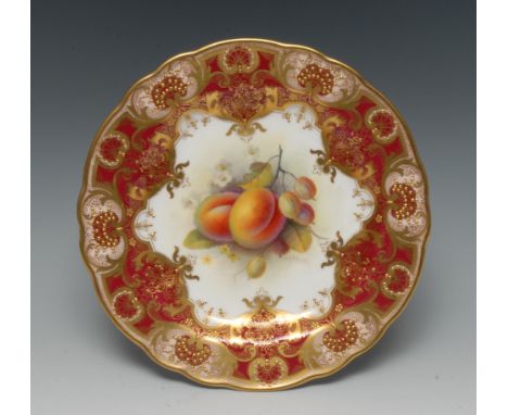 A Royal Worcester shaped circular plate, painted by Albert Shuck, signed, with ripe peaches and gooseberries, within fancy gi