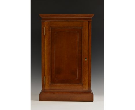 An Edwardian gentleman's mahogany smoking compendium, the pedestal with a moulded oversailing top above a slightly projecting