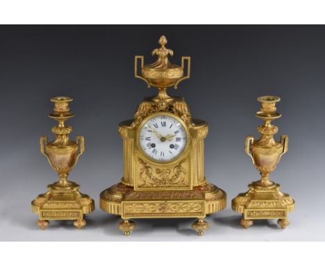 A 19th century French gilt metal clock garniture, 9.5cm convex enamel dial inscribed with Roman and subsidiary Arabic numeral