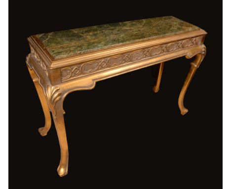 An 18th century style giltwood centre table, the rounded rectangular top with inset marble panel, above a deep blind fretwork