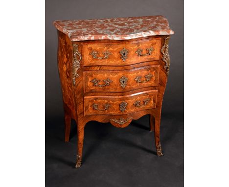 A Louis XV Revival gilt metal mounted rosewood, kingwood and marquetry bombe shaped commode, of small proportions, marble top