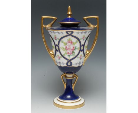 A Mintons two handled pedestal ovoid vase, decorated with  roses within a blue ribbon cartouche, angular gilt handles, slight