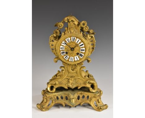 A 19th century French gilt-metal cartouche-shaped mantel clock, 8.5cm circular dial with enamel cartouches inscribed with Rom